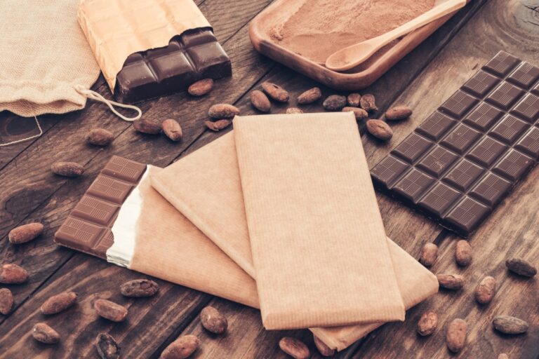 dark-chocolate-bars-with-cocoa-beans-wooden-table